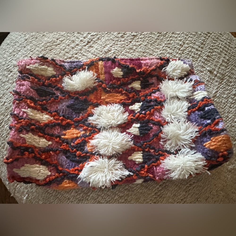 Anthropologie’s Jasper & Jeera Multicolor Pom-Pom Clutch